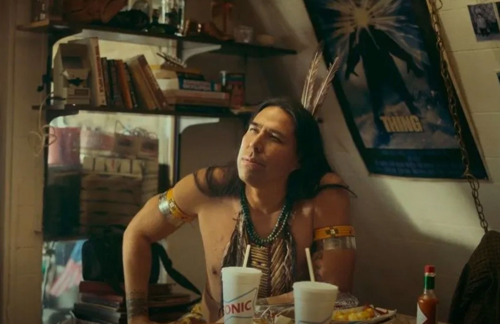 A still from an epsiode of Reservation Dogs, now in its second season on FX. Actor & writer Dallas Goldtooth is in traditional Native dress as the Ancestor, William Knifeman.