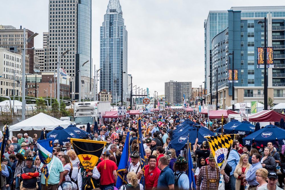 A photo from a recent Cincinnati Oktoberfest, where a massive crowd of people who are mostly drunk are squished between big downtown buildings and over the expressway instead of nestled next to fountain square like they should be.